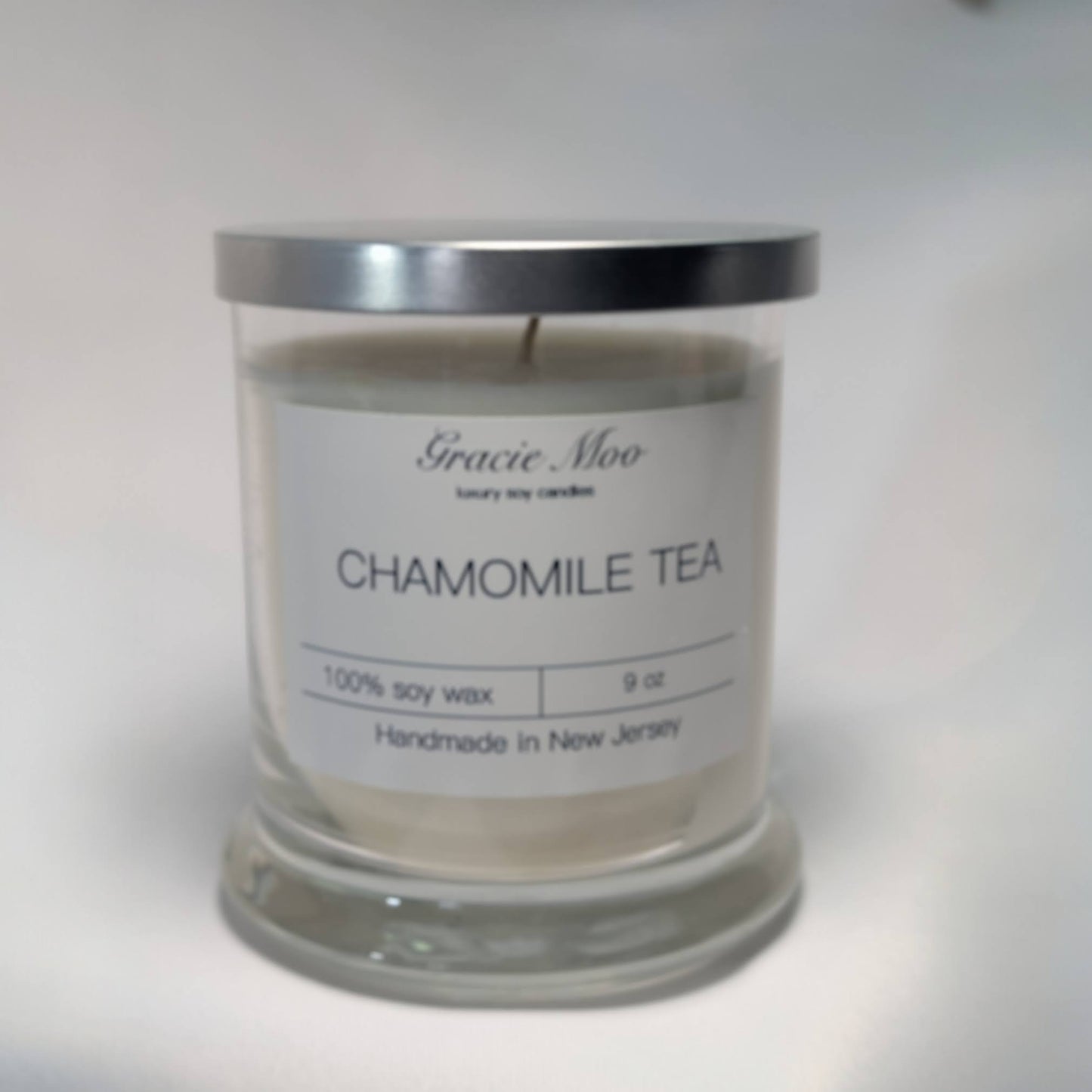 Chamomile Tea Status Candle by Gracie Moo Candles, featuring a soothing candle with chamomile tea-inspired design and warm glow.