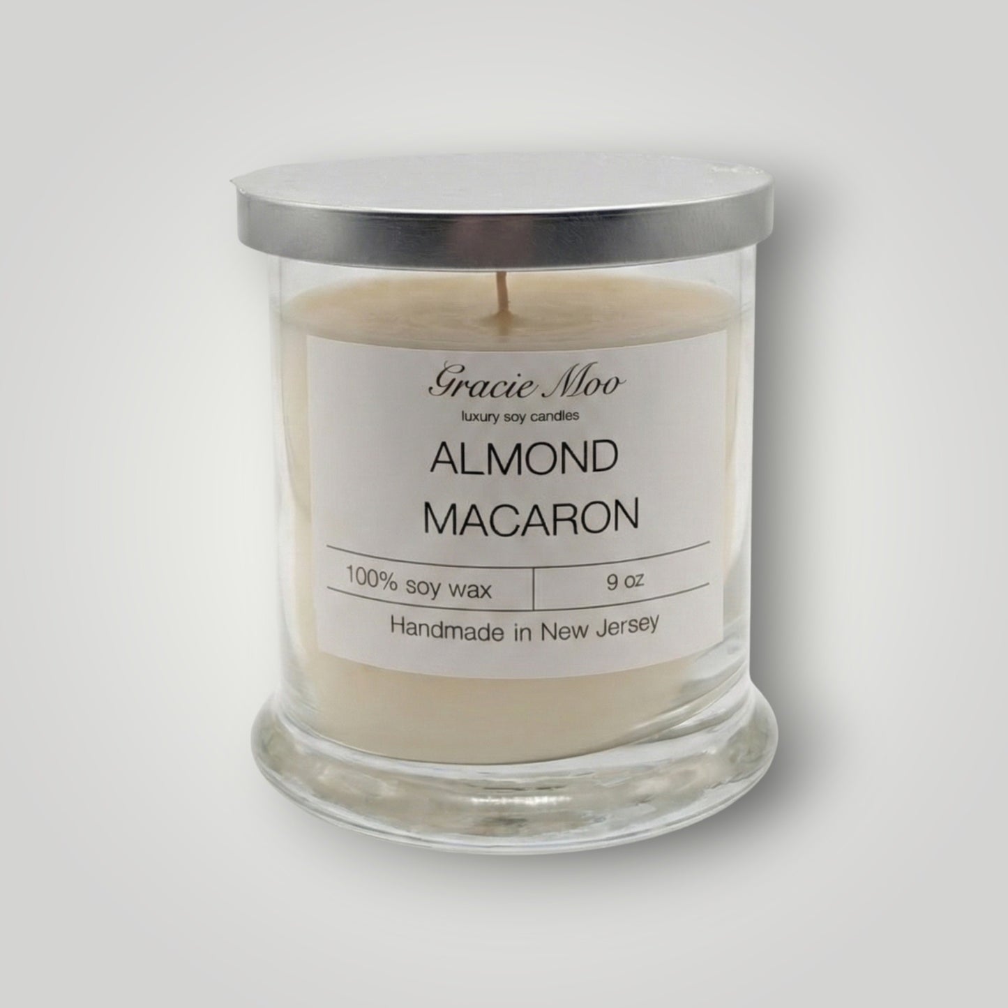 Almond Macaron Status Candle by Gracie Moo Candles, featuring a delicate almond macaron design and soft pastel colors.