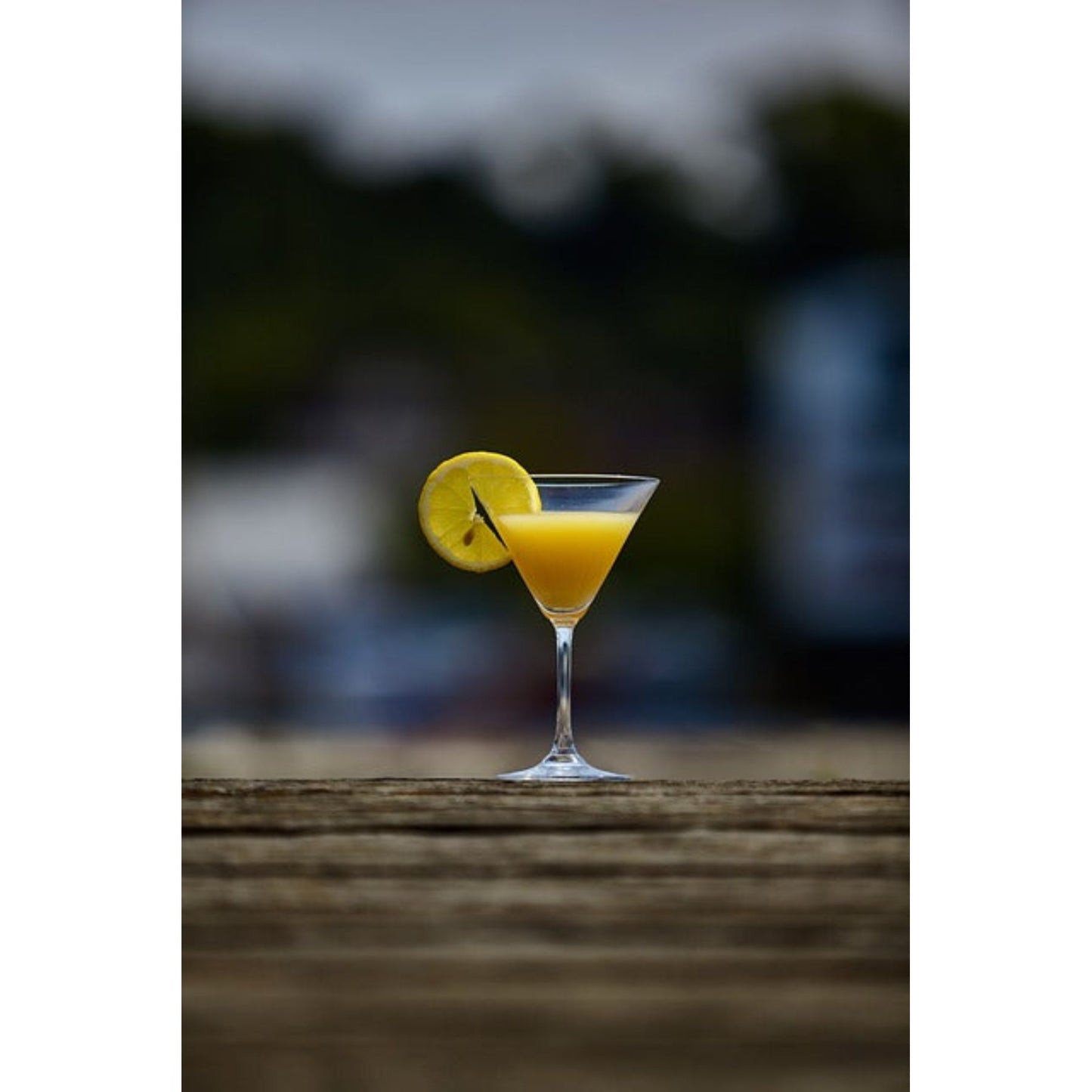 Limoncello Creme Status Candle by GracieMoo Candles, featuring a bright yellow color and elegant glass container.