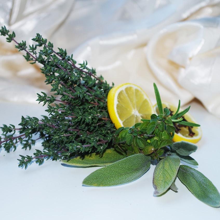 Rosemary Sage Status Candle by Gracie Moo Candles, featuring a soothing green hue and elegant glass container.