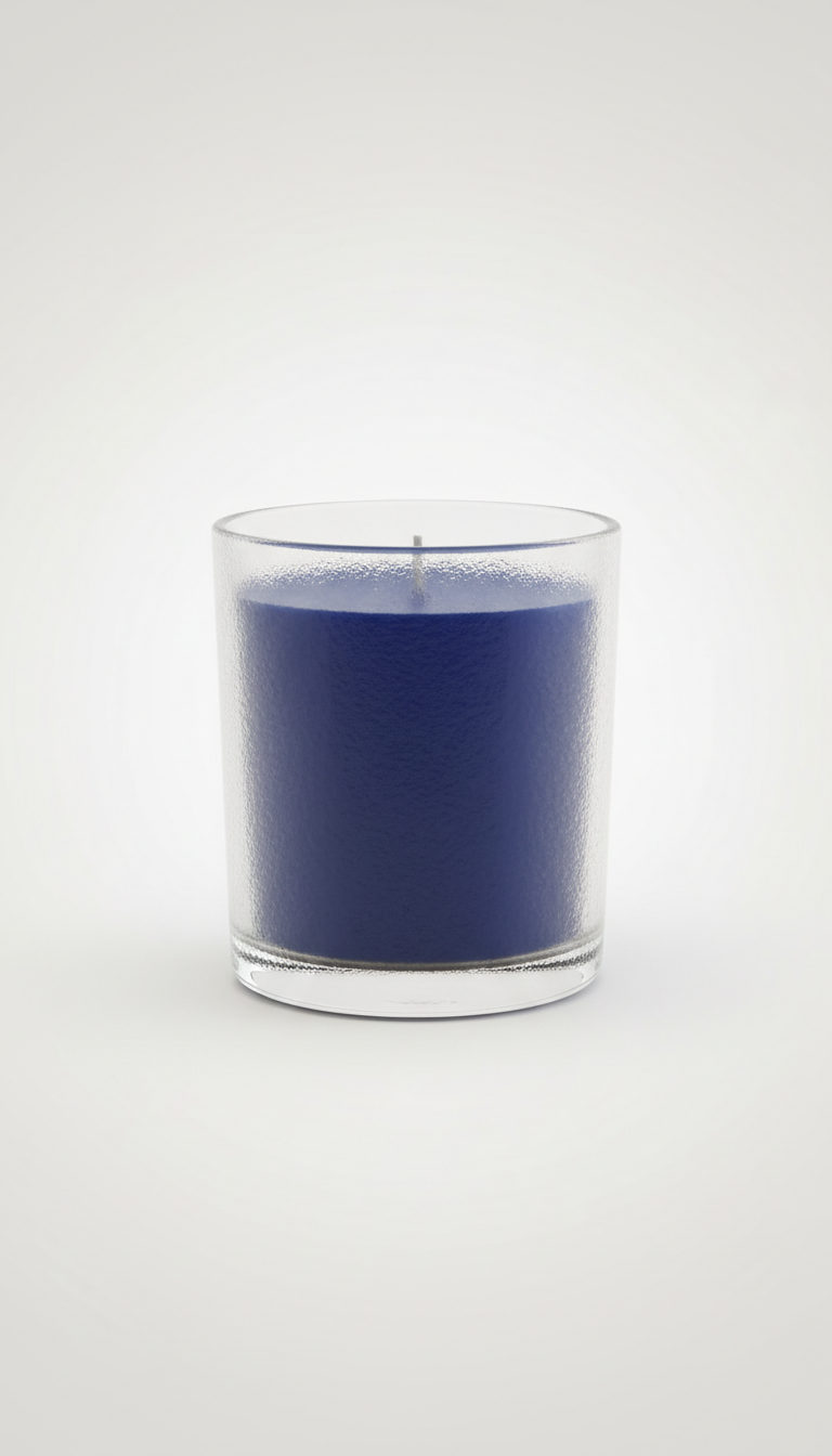 Gracie Moo Candles decorative candle with floral design in a glass jar, showcasing warm amber glow and intricate pattern.