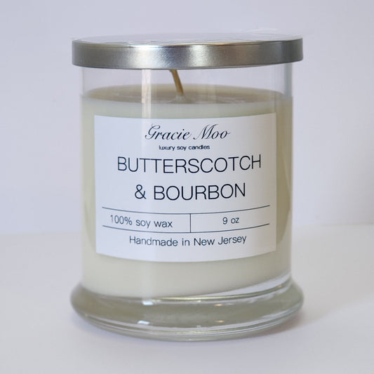 Butterscotch & Bourbon candle by Gracie Moo Candles in a stylish glass jar with warm, inviting colors.