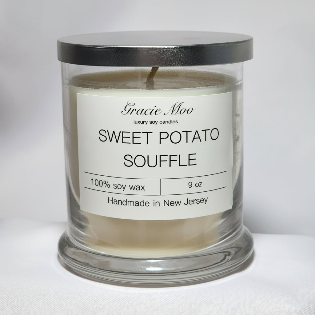 Sweet Potato Soufflé candle by Gracie Moo, showcasing a warm, inviting glow in a decorative jar.