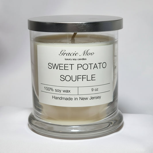 Sweet Potato Soufflé candle by Gracie Moo, showcasing a warm, inviting glow in a decorative jar.