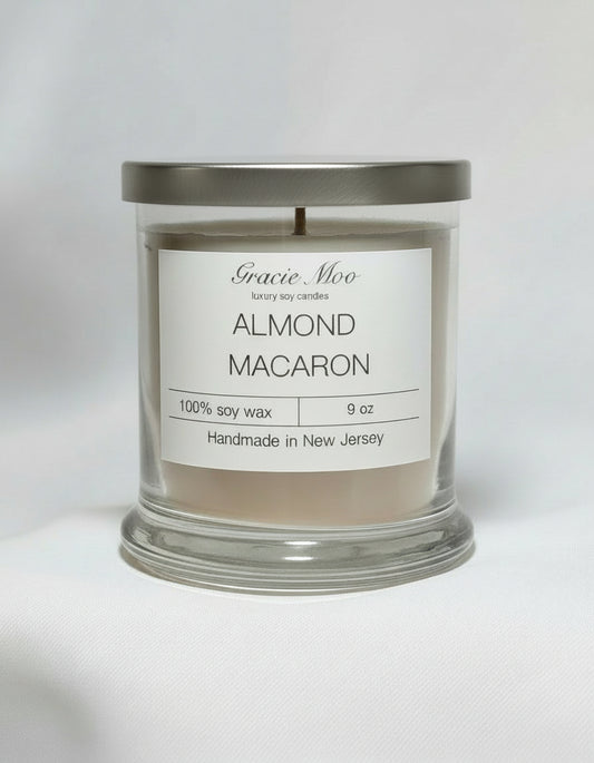 Almond Macaron candle by Gracie Moo Candles, featuring a decorative design and vibrant color in a sleek glass container.