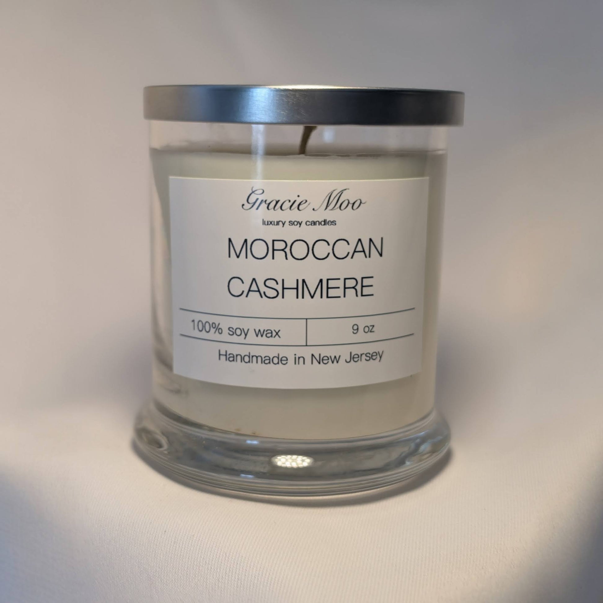 Moroccan Cashmere Status Candle by Gracie Moo Candles, elegant candle with a soft, luxurious appearance and decorative design.