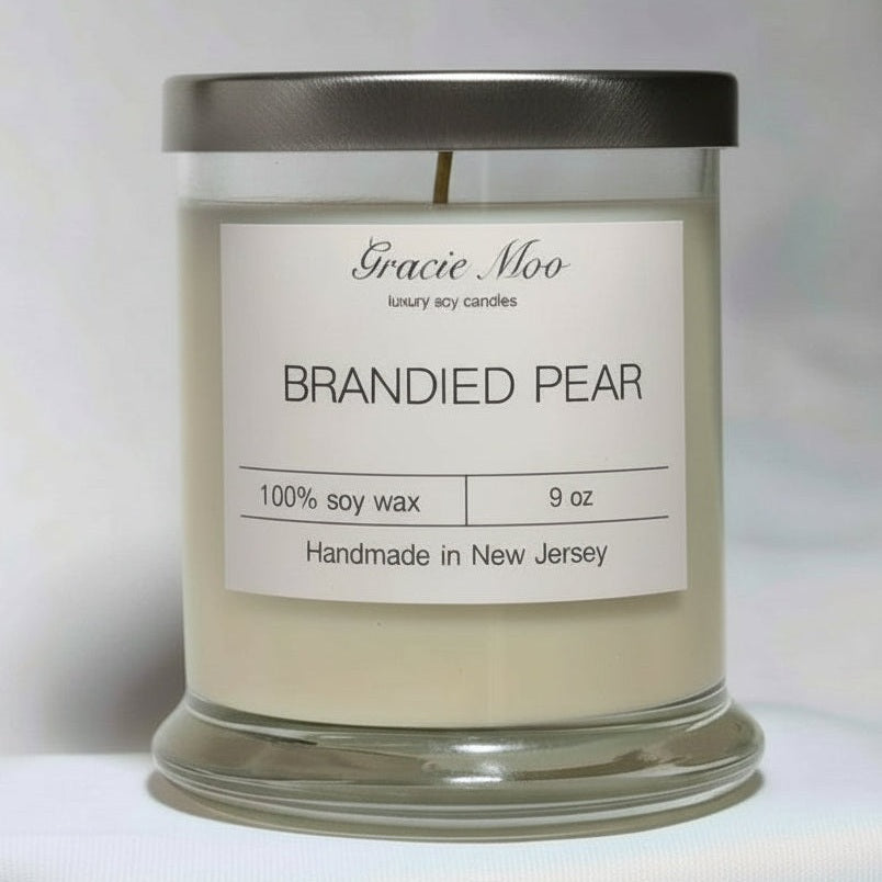 Candle with 'Gracie Moo' label on a white background