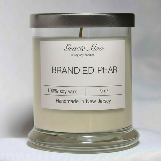 Candle with 'Gracie Moo' label on a white background