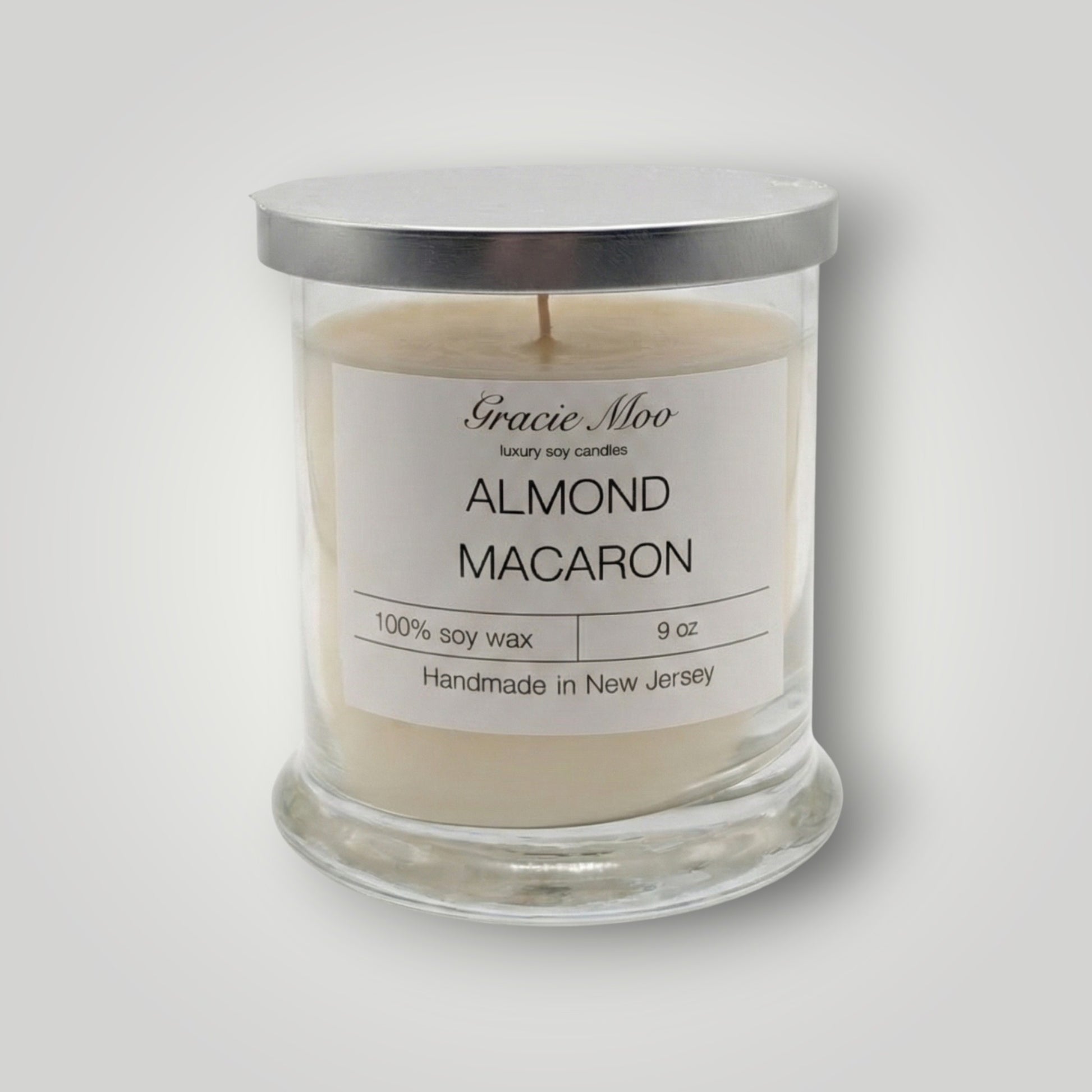 Almond Macaron Status Candle by Gracie Moo Candles, featuring a delicate almond macaron design and soft pastel colors.