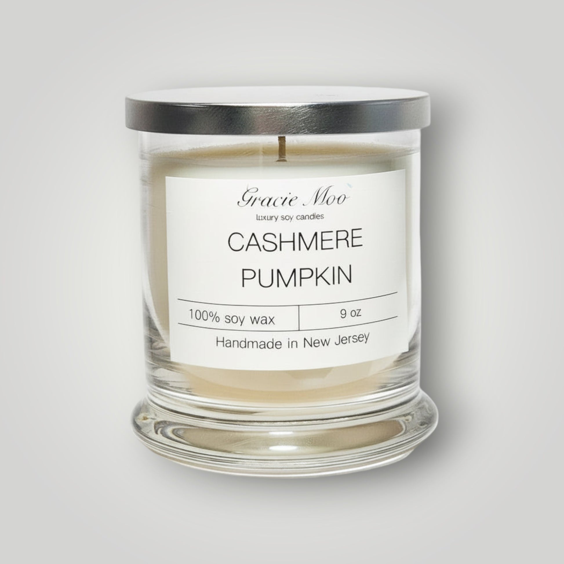 Gracie Moo Candles cashmere pumpkin scented candle with a warm, cozy pumpkin design and soft glow.